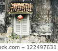 Beautiful rustic Sino-Portuguese architecture background at shophouse building with vintage window and red lantern 122497631