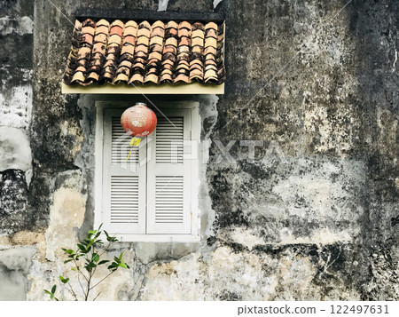 Beautiful rustic Sino-Portuguese architecture background at shophouse building with vintage window and red lantern 122497631