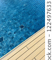 Swimming pool top view background with wood terrace 122497633