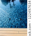 Swimming pool top view background with wood terrace 122497634