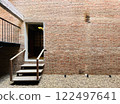 Beautiful vintage red bricks building exterior design with step led to interior, Earth tone old building design 122497641