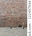 Grunge brick wall background and texture exterior facade 122497644