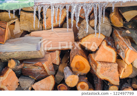 Firewood and icicles Firewood and icicles 122497799