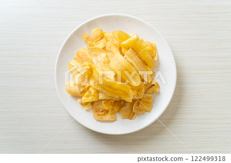 Banana Chips - fried or baked sliced banana Banana Chips - fried or baked sliced banana 122499318