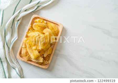 Banana Chips - fried or baked sliced banana 122499319