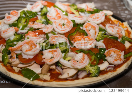 Preparing seafood homemade pizza. close up. 122499644
