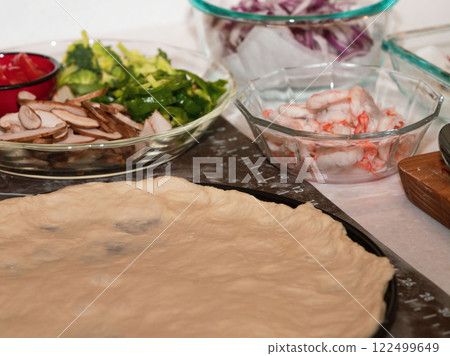 Preparing seafood homemade pizza. close up. Preparing seafood homemade pizza. close up. 122499649