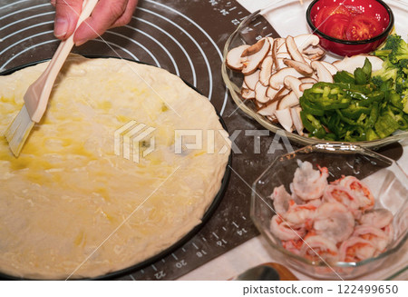 Preparing seafood homemade pizza. close up. 122499650