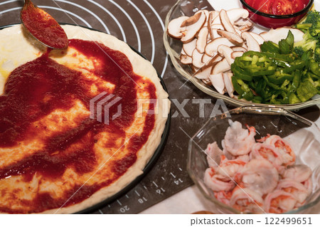 Preparing seafood homemade pizza. close up. 122499651