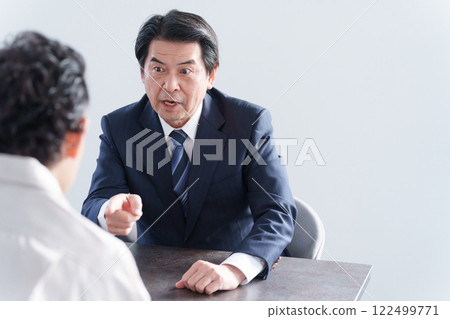 Angry businessman and man 122499771