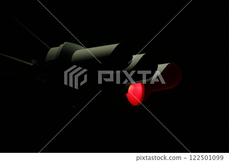 Traffic lights with red lights on at night Traffic lights with red lights on at night 122501099