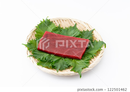 A slice of lean bluefin tuna served on a bamboo basket 122501462