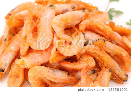 Deep fried shrimp snacks with shells on a light background Deep fried shrimp snacks with shells on a light background 122501901
