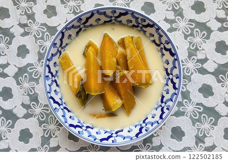 Poached Pumpkin in Coconut Milk, Thai food. Sweet Pumpkin Slices in Creamy Coconut Sauce Dessert Bowl Poached Pumpkin in Coconut Milk, Thai food. Sweet Pumpkin Slices in Creamy Coconut Sauce Dessert Bowl 122502185
