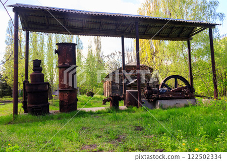 Old steaming threshing machine in Open air Museum of Folk Architecture and Folkways of Middle Naddnipryanschina in Pereyaslav, Ukraine 122502334