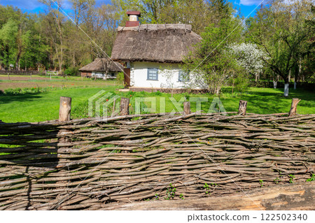 Ancient traditional ukrainian rural house in Open air Museum of Folk Architecture and Folkways of Middle Naddnipryanschina in Pereyaslav, Ukraine Ancient traditional ukrainian rural house in Open air Museum of Folk Architecture and Folkways of Middle Naddnipryanschina in Pereyaslav, Ukraine 122502340