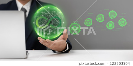 Businessman holding a green sustainability icon representing circular economy, eco-friendliness, and corporate responsibility. Ideal for ESG reports, green energy promotions 122503504