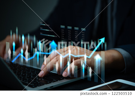 Businessman using computer to analysis data with graph and research financial marketing and business growth target plan Businessman using computer to analysis data with graph and research financial marketing and business growth target plan 122503510