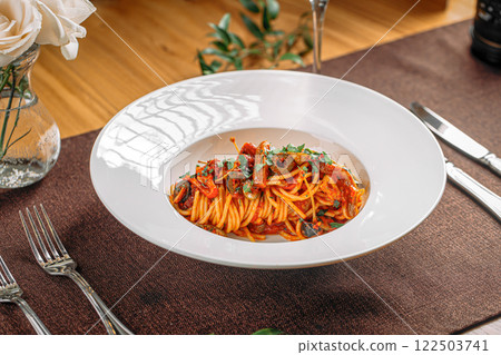 Spaghetti pasta with tomato sauce and olives Spaghetti pasta with tomato sauce and olives 122503741