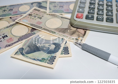 Thumbnails of articles about money and calculators, bills, calculators, etc. 122503835