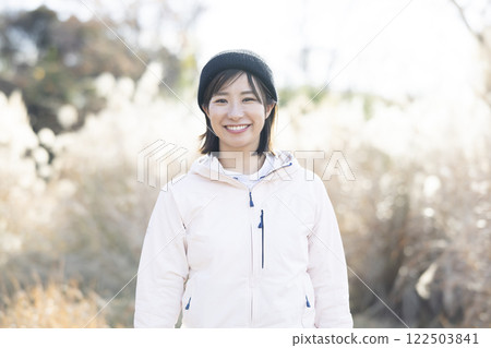 Woman enjoying camping Woman enjoying camping 122503841