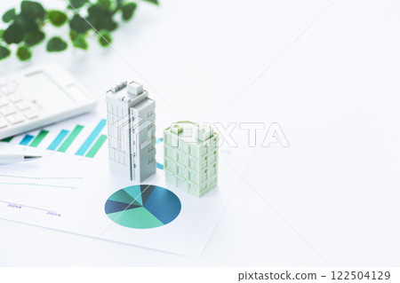 Business graph and corporate building and calculator Business graph and corporate building and calculator 122504129