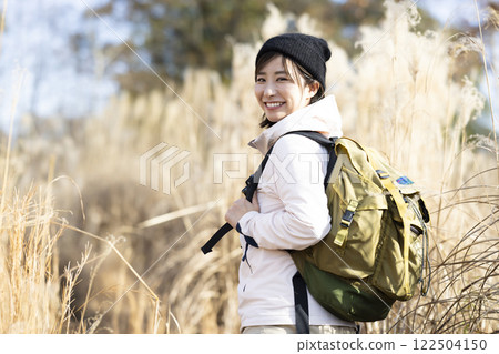 Woman enjoying hiking Woman enjoying hiking 122504150