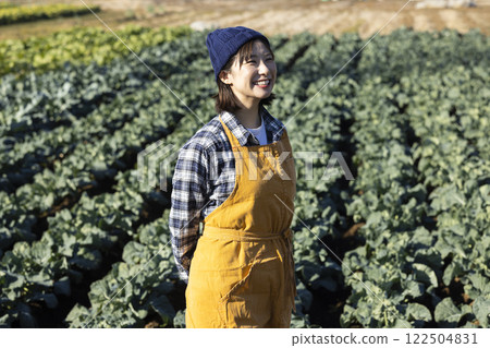 Farmer woman working in the field Farmer woman working in the field 122504831