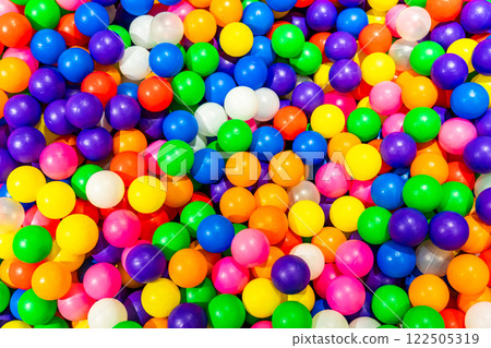 A cheerful ball pit filled with bright and colorful plastic balls. A cheerful ball pit filled with bright and colorful plastic balls. 122505319
