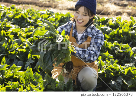 Scene of a woman working in the fields 122505373