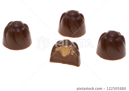 chocolate candies with hazelnuts isolated chocolate candies with hazelnuts isolated 122505880