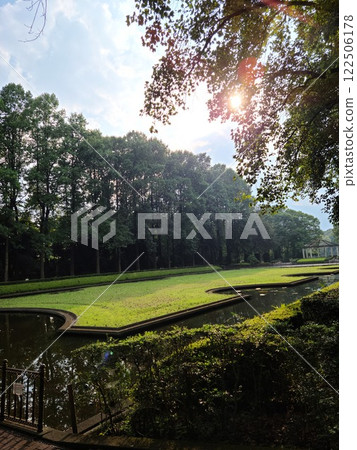 A park surrounded by beautiful trees 122506178