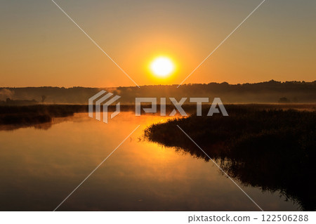 View of river in the mist at sunrise. Fog over river at morning 122506288