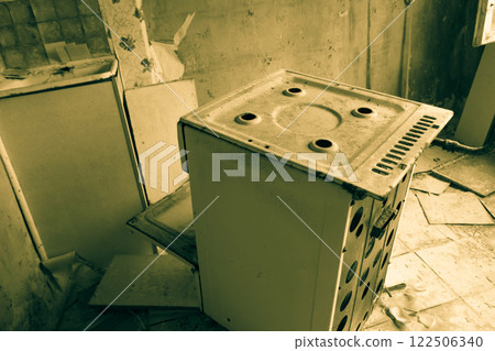 Kitchen of abandoned apartment in the ghost town Pripyat in Chernobyl Exclusion Zone, Ukraine. Black and white tone Kitchen of abandoned apartment in the ghost town Pripyat in Chernobyl Exclusion Zone, Ukraine. Black and white tone 122506340