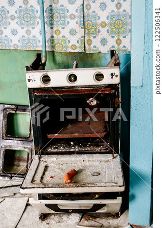 Kitchen of abandoned apartment in the ghost town Pripyat in Chernobyl Exclusion Zone, Ukraine 122506341