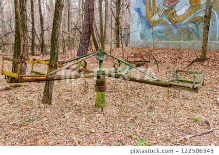 Abandoned children's playground in the ghost town Pripyat in Chernobyl Exclusion Zone, Ukraine Abandoned children's playground in the ghost town Pripyat in Chernobyl Exclusion Zone, Ukraine 122506343