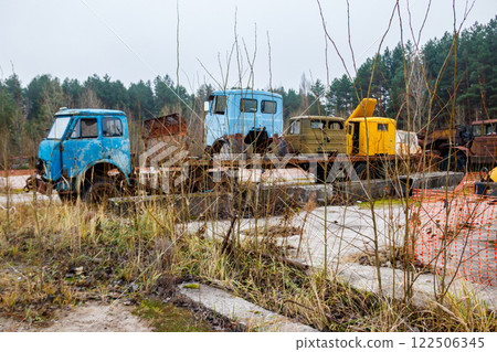 Old rusty abandoned damaged trucks in Chernobyl exclusion zone, Ukraine Old rusty abandoned damaged trucks in Chernobyl exclusion zone, Ukraine 122506345