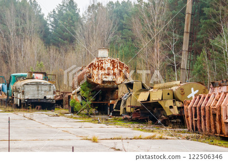 Old rusty abandoned damaged trucks in Chernobyl exclusion zone, Ukraine Old rusty abandoned damaged trucks in Chernobyl exclusion zone, Ukraine 122506346