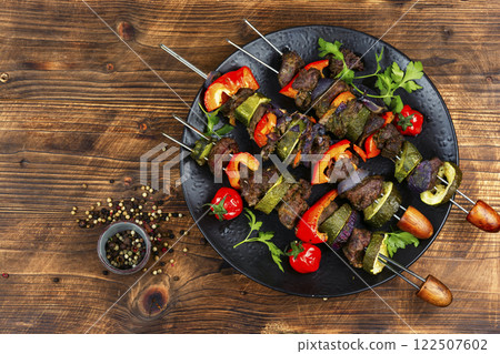 Skewers with meat and vegetables. 122507602