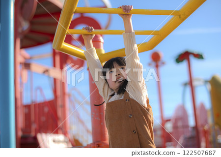Girls playing in the clouds in the park 122507687