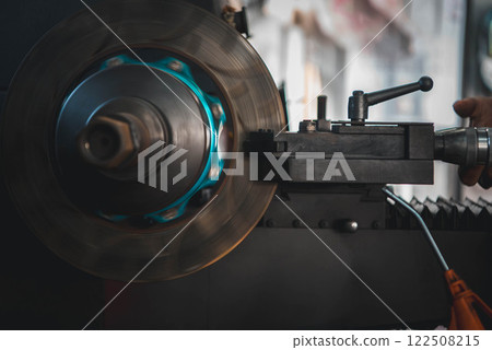 Checking car brake system for repair at car garage 122508215