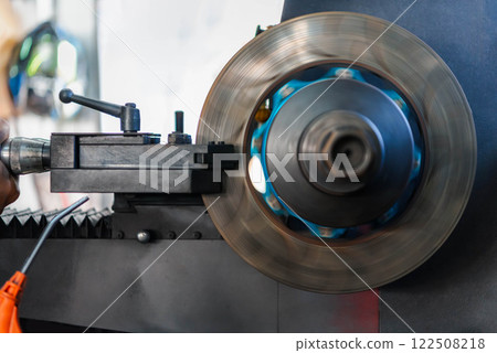 Checking car brake system for repair at car garage Checking car brake system for repair at car garage 122508218