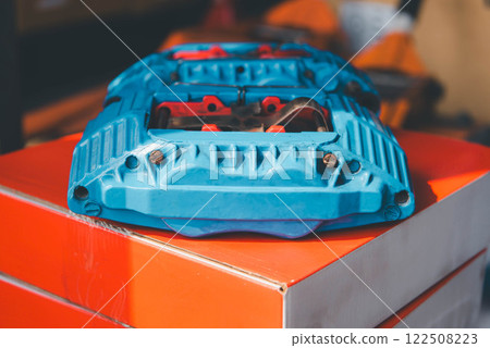Checking car brake system for repair at car garage Checking car brake system for repair at car garage 122508223