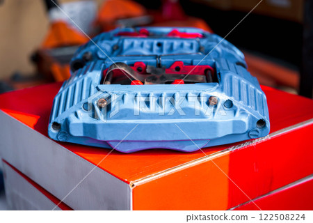 Checking car brake system for repair at car garage Checking car brake system for repair at car garage 122508224