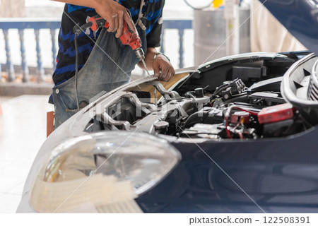 Checking car body work fiber bumper at car garage 122508391