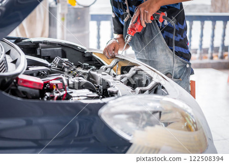 Checking car body work fiber bumper at car garage Checking car body work fiber bumper at car garage 122508394