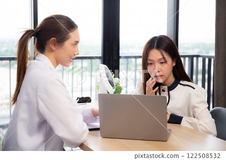 Young asian patient woman consulting with doctor in coat about wrinkle and skin for rejuvenate. 122508532
