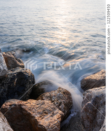 Long exposure of waves and stones on Mediterranean seacoast Long exposure of waves and stones on Mediterranean seacoast 122509450