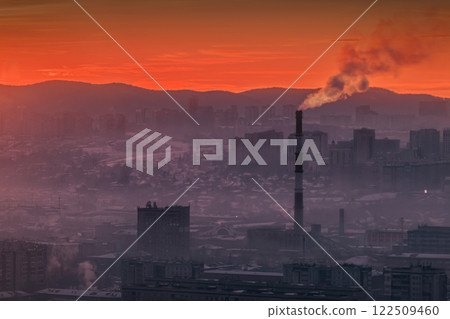 An Industrial Skyline at Sunrise featuring Prominent Emissions and Atmospheric Effects An Industrial Skyline at Sunrise featuring Prominent Emissions and Atmospheric Effects 122509460