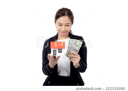 Portrait young asian businesswoman holding house and money for mortgage isolated. Portrait young asian businesswoman holding house and money for mortgage isolated. 122510260